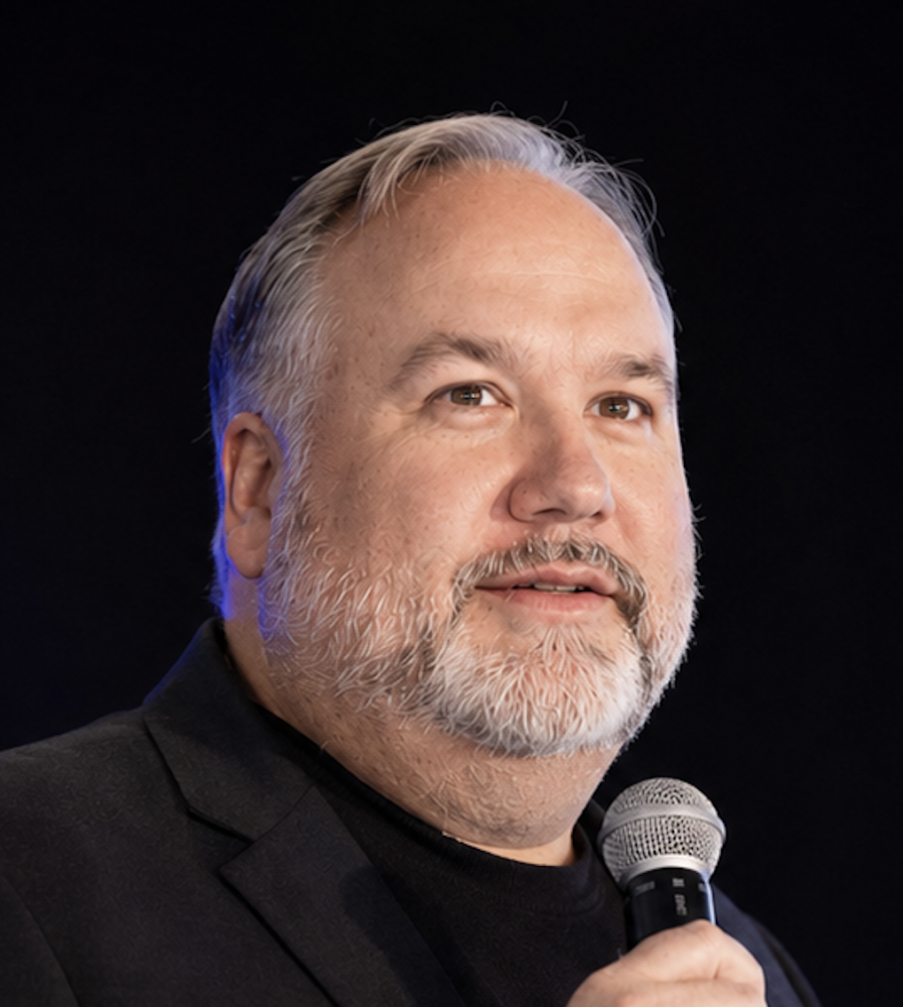Dan Schaupner speaking on stage